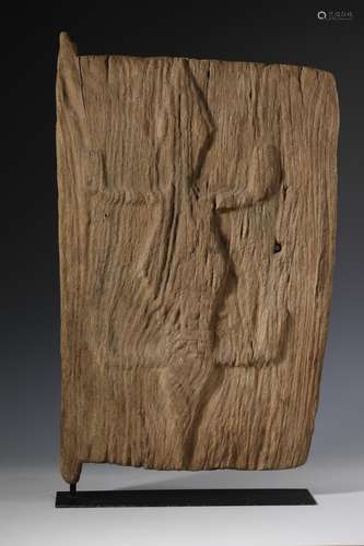 Mali, weathered wooden granary door with a reptile in relief