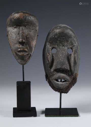 Liberia, a Dan and a Kran wooden hand masks, the second item...