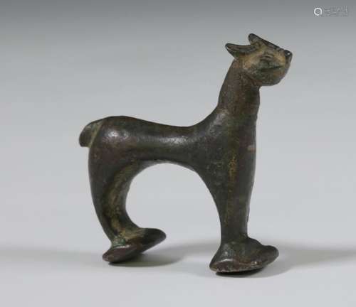 An antique bronze figure of a cat.