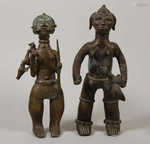 Benin, bronze couple; the man a hunter with prey, the woman ...