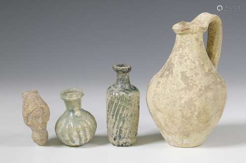 Two Roman glass bottles and a terracotta flask, 2nd-3rd cent...