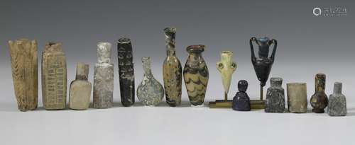 A collection of fifteen glass and stone small bottles;