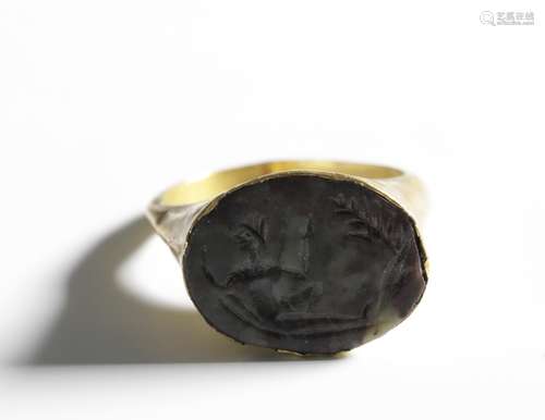 Roman a agat intaglio, 2nd century. set in a golden ring pos...