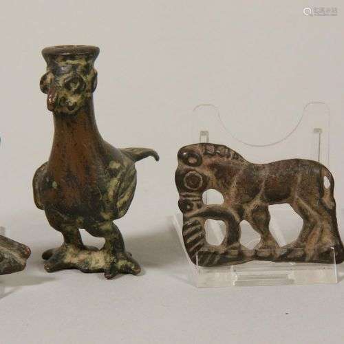 Four Ordos style applieques and a possible Persian bronze fi...