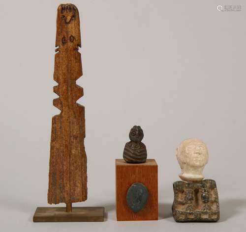 Antique bone and a stone idol and Bactria; a stone head with...