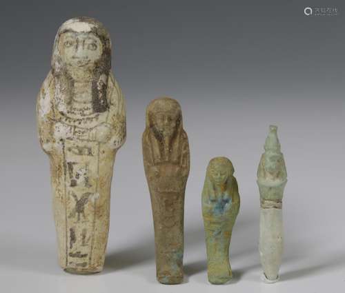 Egypt, three terracotta Ushabti's and an amulet, Late Period...