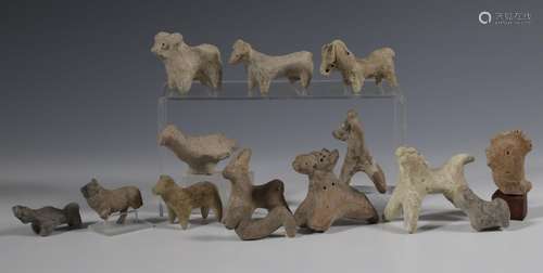 A collection of fourteen various terracotta animal figures, ...