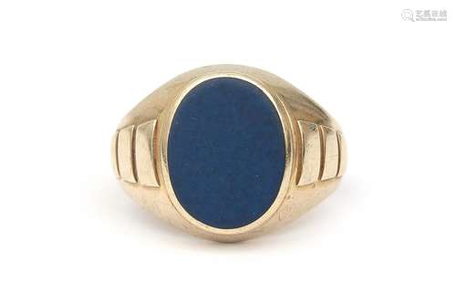 A 14 karat gold lapis lazuli signet ring. Gross weight: 11 g...