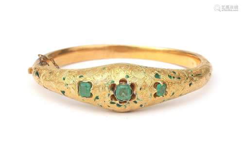 An 18 karat gold bracelet with emerald and enamel. A tapered...