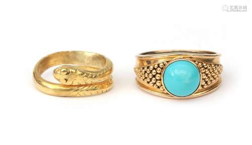 A gold snake ring and a gold turquoise ring. An 18 karat gol...