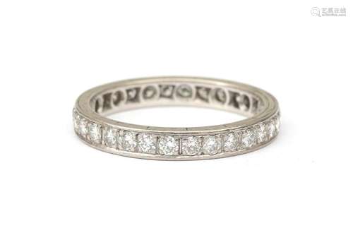 A 14 karat white gold diamond eternity band. Featuring brill...