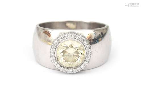 An 18 karat white gold moissanite and diamond cluster ring. ...