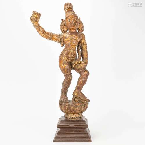 An antique wood sculptured figurine of Oriental origin, prob...