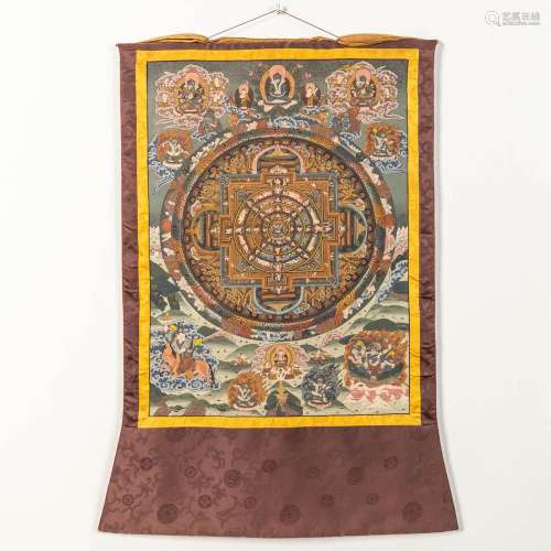 An Oriental Thangka, with hand-painted decor on a silk base.