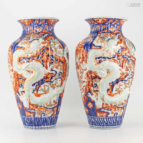 A pair of vases made of Japanese porcelain and decorated wit...