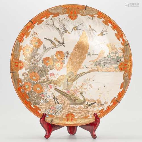 A large Japanese Kutani plate with decor of birds and flower...