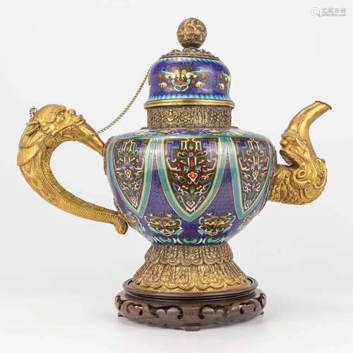 A Tibetan ceremonial ewer made of gilt bronze and finished w...