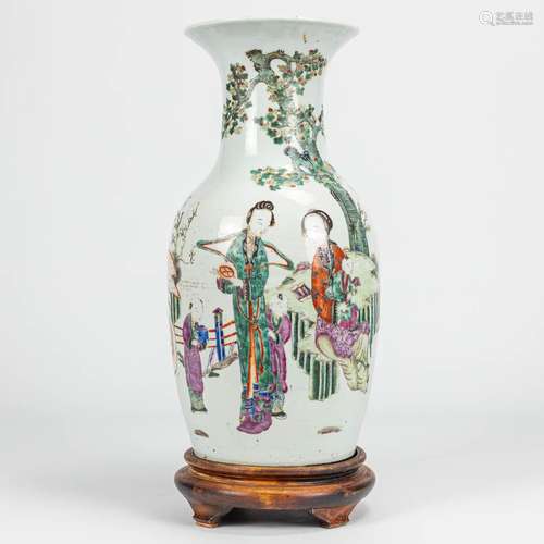 A vase made of Chinese porcelain decorated with ladies, chil...