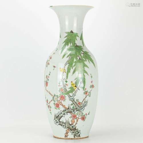 A vase made of Chinese porcelain and decorated with birds an...