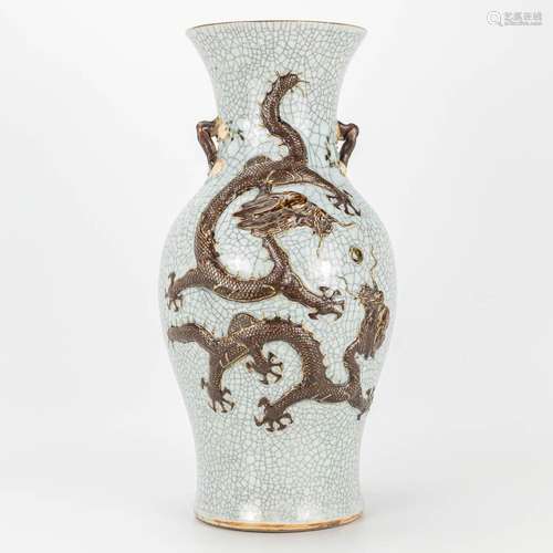 A vase with dragon decor and made of Chinese earthenware, Na...