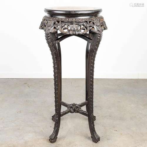 An oriental plant stand made of hardwood and finished with a...