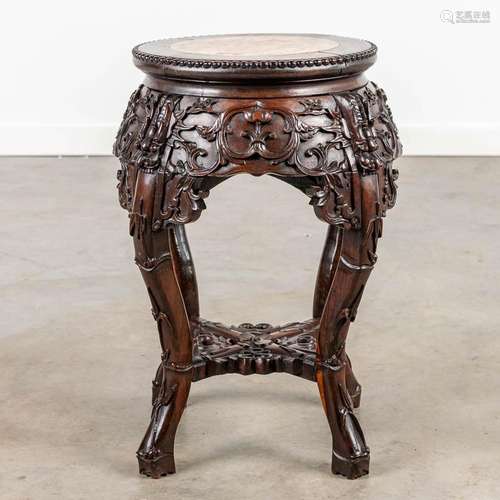 A stand made of Chinese hardwood with a marble top.