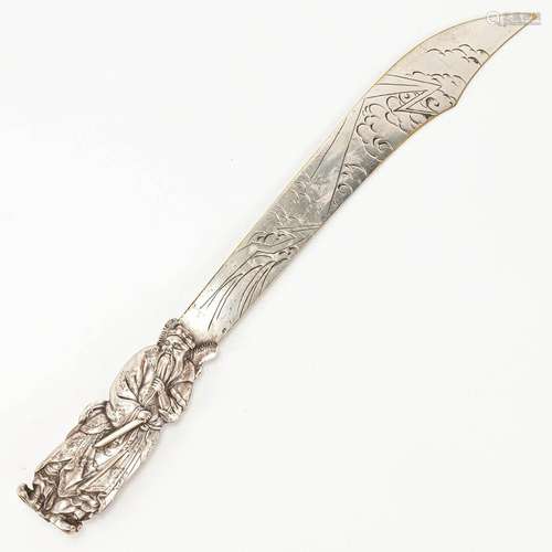 A silver-plated letter opener with a Chinese wise man and dr...