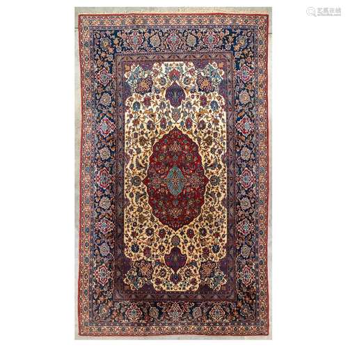 A large Oriental hand-made carpet. Kerman. (222 x 377 cm)