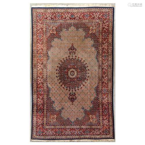 A large Oriental, hand-made carpet with signature. Bakhtiar....