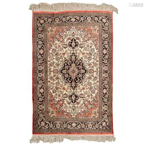 An Oriental hand-made carpet, Kirman. Made with silk. (103 x...