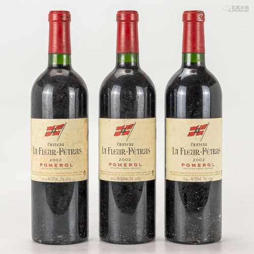 A collection of 3 bottles Chateau La Fleur Petrus, 2002.