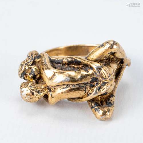 An antique gold-plated silver ring with erotic scene marked ...