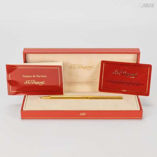 An ST. Dupont gold-plated ballpoint pen with the original ca...