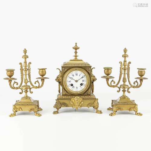 A three-piece garniture clock made of a bronze clock and can...