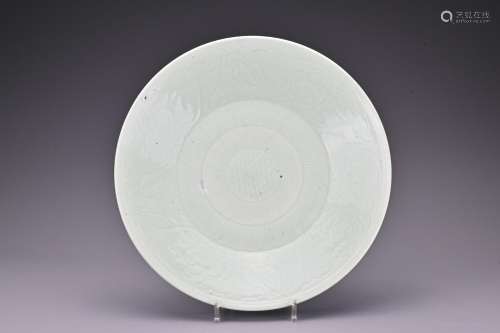 An 18th century Chinese large celadon dish with incised