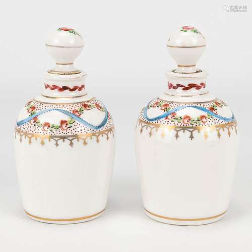 A pair of pharmacy bottles made of porcelain with a hand-pai...