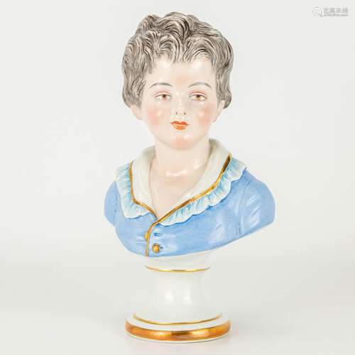 A porcelain buste of a boy, marked 'D'après Houdon...