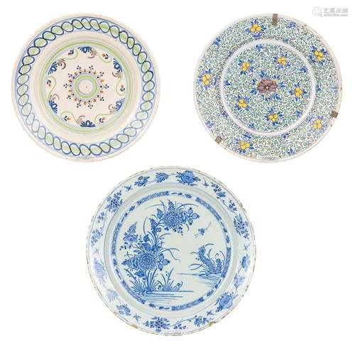 A collection of 3 large plates made of faience in Delft, The...