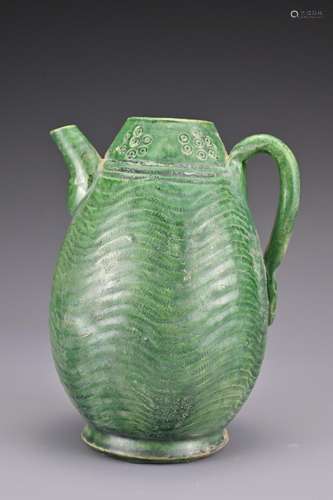 A Chinese green-glazed pottery ewer. The melon-shaped