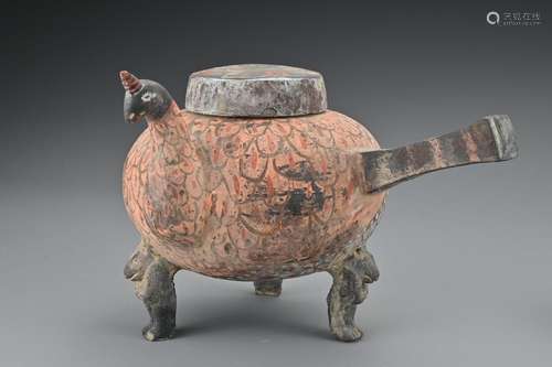 A Chinese Han dynasty painted pottery tripod ewer and