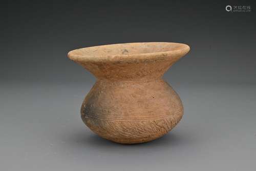 A Chinese Neolithic pottery jar. The squat form body