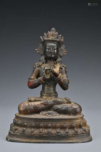 A Tibetan bronze Buddha. The seated figure of Tara on a