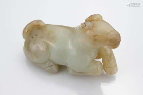 Chinese pale celadon jade carving of a recumbent horse.
