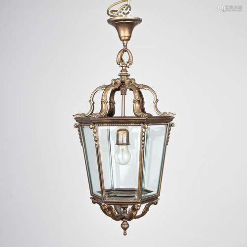 A hall lantern chandelier made of glass and bronze