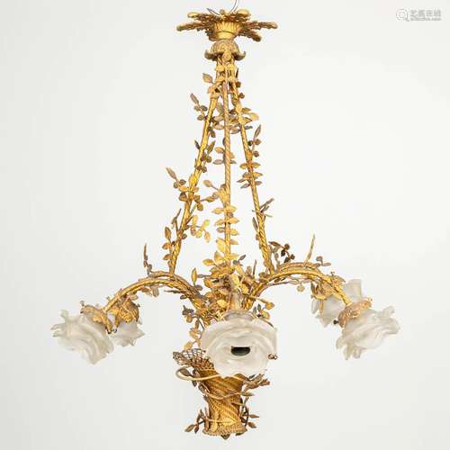 A chandelier in the shape of a flower basket, made of bronze...