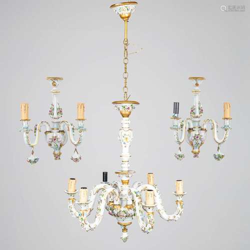 A chandelier and matching wall lamps made of porcelain with ...