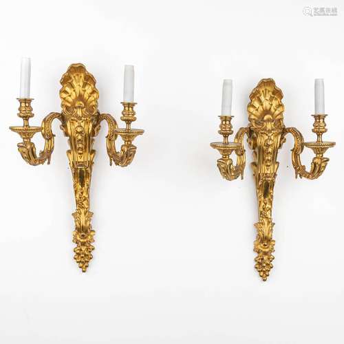 A pair of large wall lamps made of bronze in Louis XV style.