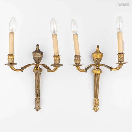 A pair of bronze wall lamps made in classical style. The fir...