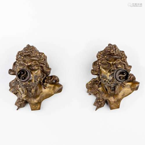 A pair of wall lamps with 'Bacchus' figurines made...