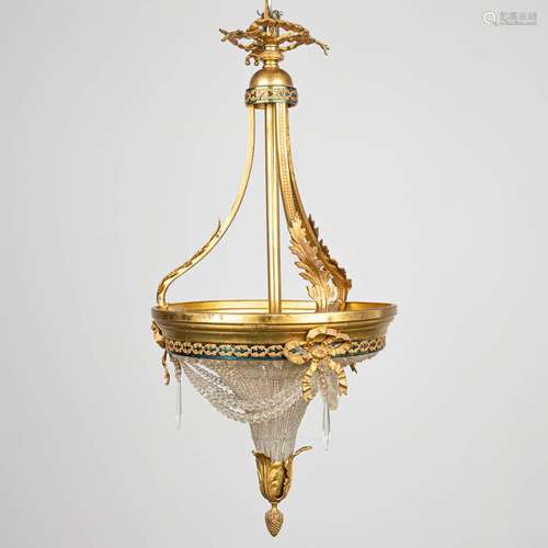 A sac-a-perles chandelier made of bronze and glass in Louis ...